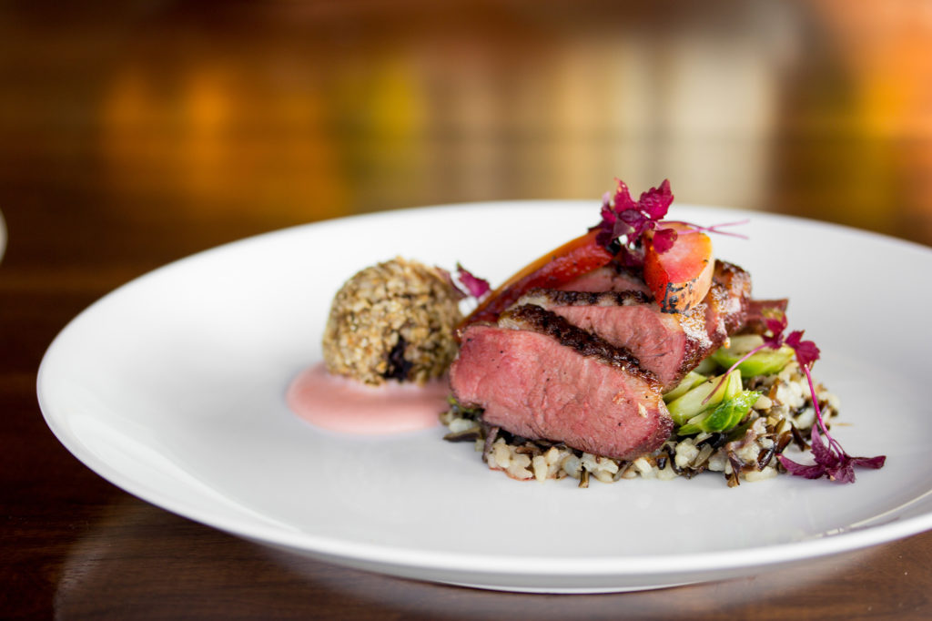 Smoked duck breast on a wheatberry risotto.