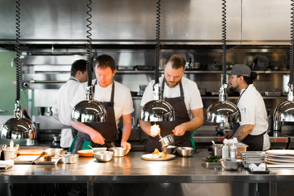 Chefs working on the line in the Canoe kitchen.